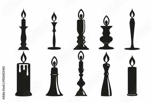 A collection of black silhouette candles with varying shapes and sizes
