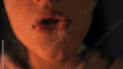 Vivid image of smiling woman showcasing tongue and pouting lips