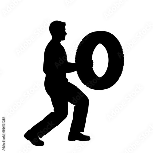 Man pushing large wheel with effort and determination