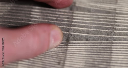 an old filter for the air in the car, a dirty old and long-used paper filter for cleaning the air in the car engine