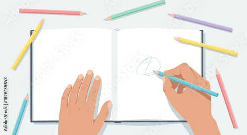 Overhead shot of a hand drawing doodles with a blue pencil in an open notebook, surrounded by colorful pencils, illustrating creativity, learning, and artistic expression.
