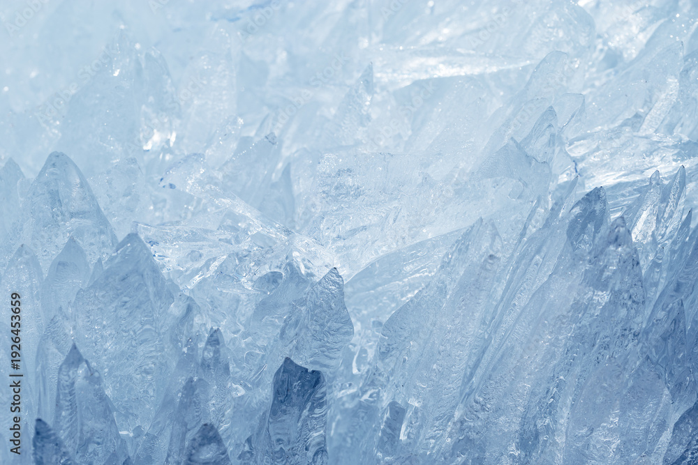 Obraz premium Natural ice formations as needles as crystalline pattern in cold seasonal environment. Concept of elemental beauty, serene wilderness mood. Macro detailed winter background with frozen icy icicles.