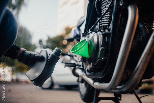 Changing motorcycle engine oil and adding technical fluids