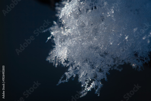 macro shot of ice crystals. Winter pattern with white snowflakes