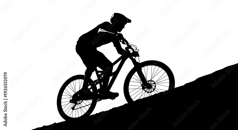 Fototapeta premium Silhouette of a mountain biker ascending a hill
