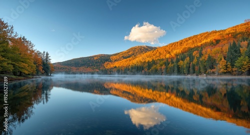 Relaxing mountain view with a tranquil lake and autumn maple trees