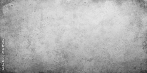 A dark aged vintage backdrop features a textured grunge metal plate with a rough grey concrete surface and a dirty brushed steel pattern for an old industrial design