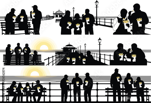 Diverse groups of people enjoying fish and chips by the sea on a pier, silhouetted against the sunset, conveying leisure and casual dining.
