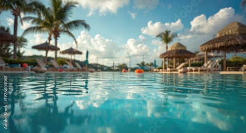 Three friends lounging and splashing playfully in a warm outdoor pool on vacation