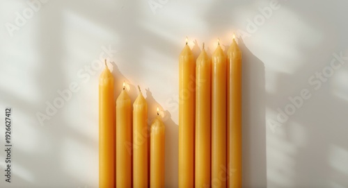 Warm beeswax candles arrang...