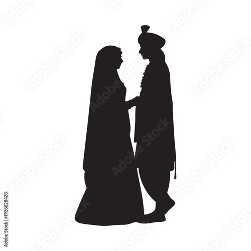Silhouette of a couple in traditional indian wedding attire facing each other