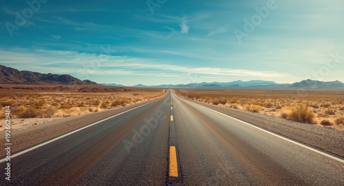 Long desert highway surroun...