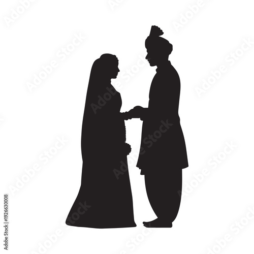 Silhouette of a bride and groom possibly indian holding hands