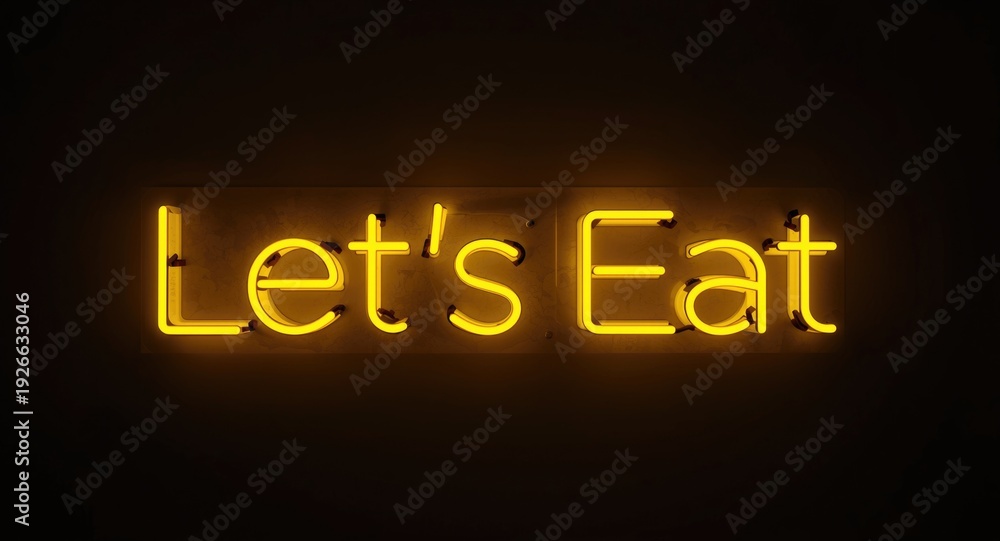 Obraz premium Yellow Neon Signage Brightly Displaying Lets Eat Phrase