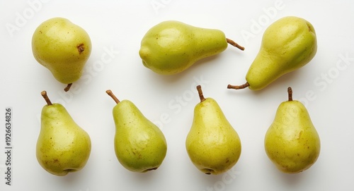 Display of six green pears ...