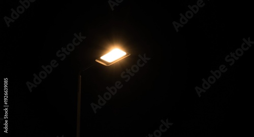 A streetlight brightly ligh...