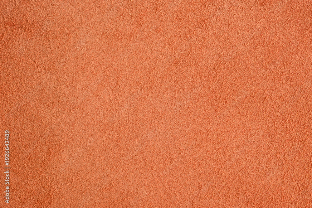 Fototapeta premium Orange leather suede fabric showing a rough and soft textured surface