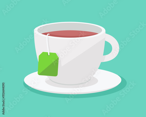 A steaming cup of tea with a green tag sits on a saucer