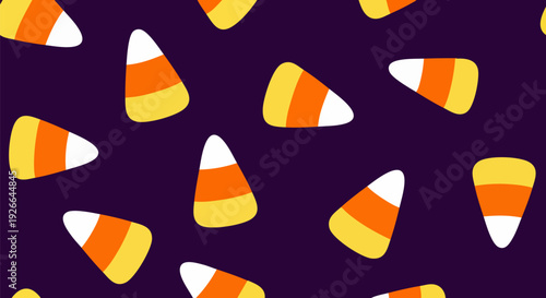 Candy corn seamless pattern. Features scattered candy corn pieces with white, orange, and yellow stripes. Created in a flat cartoon style with a dark purple background.