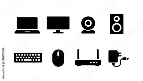 Office desk electronics: laptop, monitor, keyboard, mouse, webcam, desk speaker, router, power adapter