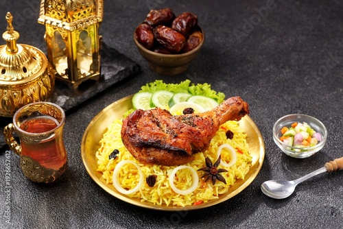 Wallpaper Mural Nasi Biryani served in a traditional plate, featuring long-grain basmati rice cooked with aromatic spices, tender chicken, caramelized onions, and fresh herbs Torontodigital.ca