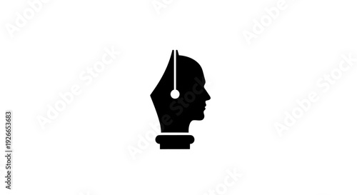 Pen nib with human head silhouette.