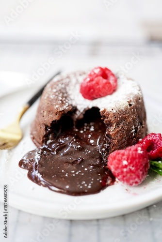 Homemade Chocolate molten lava cake served with raspberries and powdered sugar