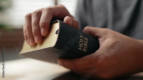 Wallpaper Mural Hands clasped prayer with Holy Bible for Christian faith, spirituality, worship, devotion, hope, and religious belief, prayer time in church, trust in God, and spiritual guidance. Torontodigital.ca