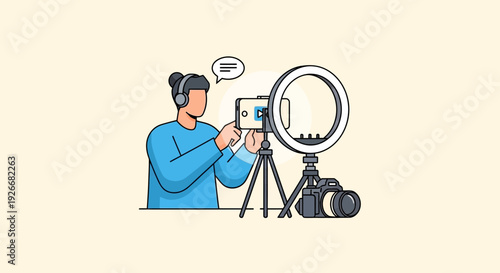 A person recording a video with a smartphone on a tripod near a camera and ring light
