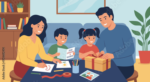 Happy young family with two children preparing a handmade gift and card for their grandparents while sitting together at a table in their cozy living room