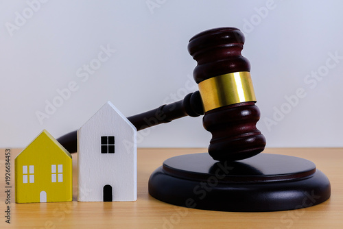 Real Estate Law Ruling with house model and wooden gavel