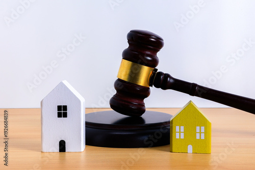 Real Estate Law Judgment with gavel and miniature house