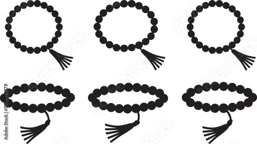 Six black prayer beads with tassels arranged in two rows on a white background rosary
