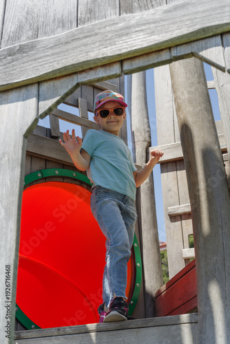 5 year old Caucasian girl playing on a playground