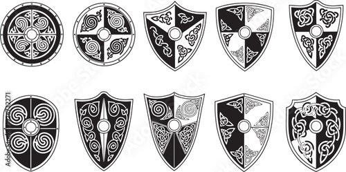 A set of black and white shields with intricate designs and patterns.