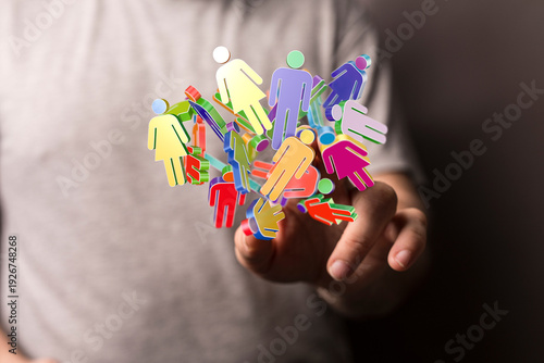 Hand holding vibrant 3D peo...