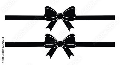 Two black ribbon bows with flowing tails a striking silhouette