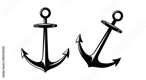 Four nautical anchors displayed in a stark black silhouette