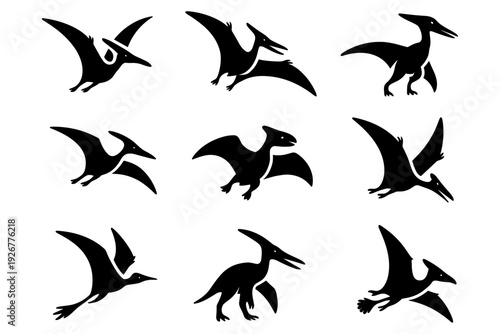 Silhouette pterodactyls in various flying and standing poses