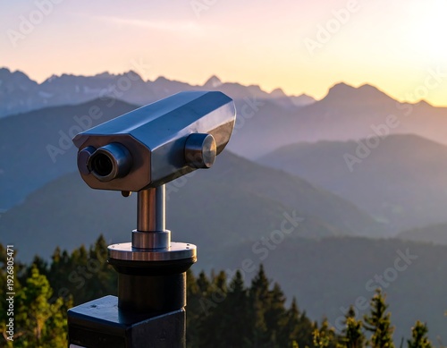 Pay-per-view telescope facing mountainous landscape at sunset with golden light