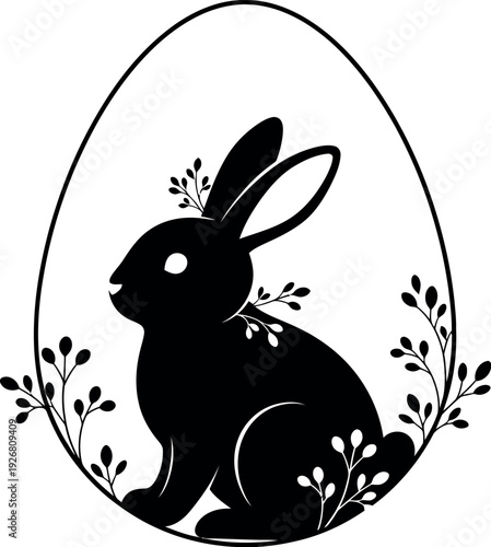 Easter bunny silhouette inside egg with floral decorations for spring