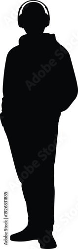 Young man silhouette wearing hoodie and headphones standing casually while listening to music or podcast representing urban lifestyle youth culture and digital entertainment