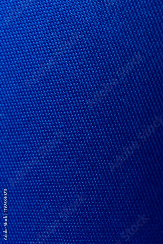 Seams on nylon fabric with stitches. Synthetic fabric texture. Macro detail.