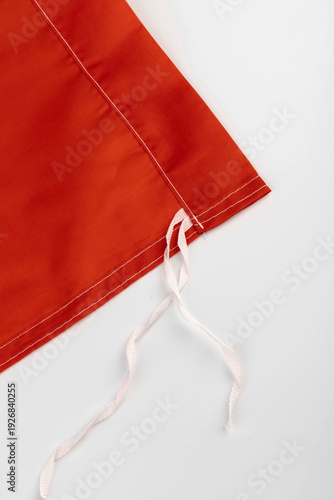 Seams on nylon fabric with stitches. Synthetic fabric texture. Macro detail.