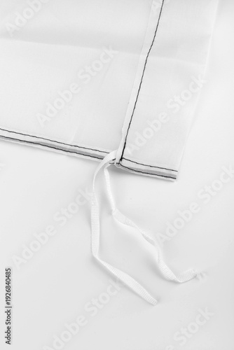 Seams on nylon fabric with stitches. Synthetic fabric texture. Macro detail.