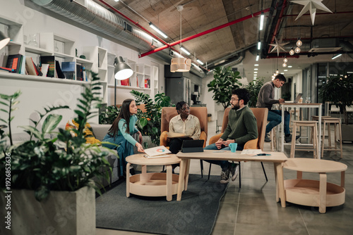 Wallpaper Mural Diverse business team collaborating in creative office space Torontodigital.ca