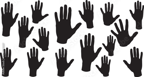 Many black hand silhouettes raised up in the air together