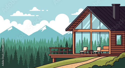 Modern wooden cabin with large glass windows and a deck overlooking a vast forest and snow-capped mountains under a clear sky.