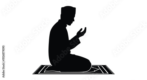 A man kneeling in prayer hands raised a striking black silhouette