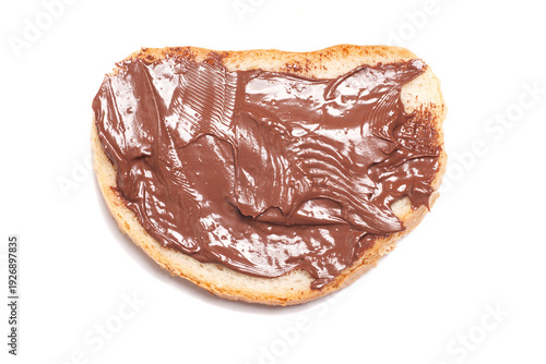 Chocolate-nut paste spread on bread isolated on white background, top view